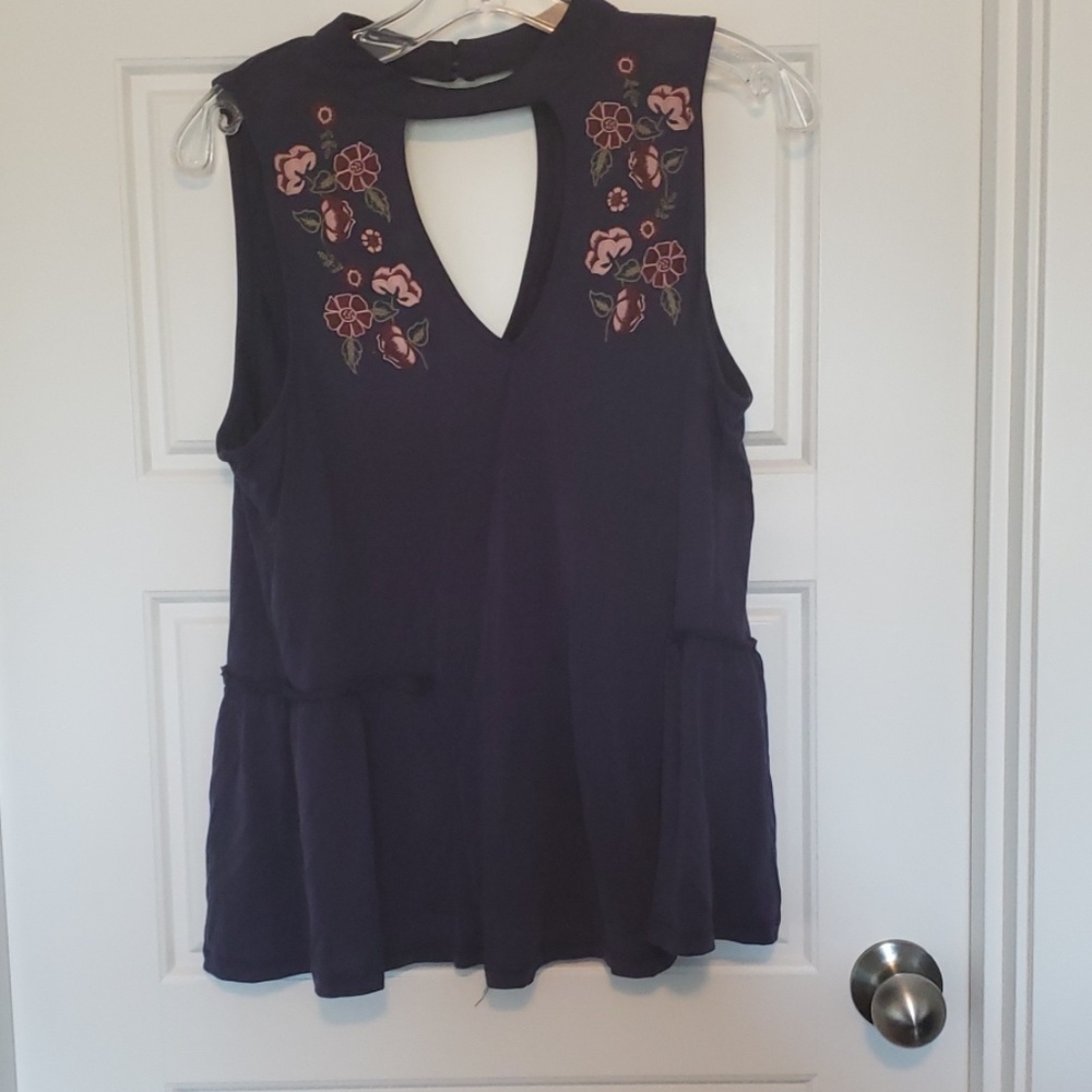 Gently worn chokeneck navy blue peplum shirt
